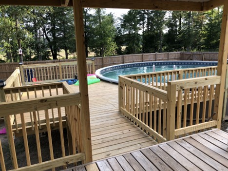deck overlooking a pool