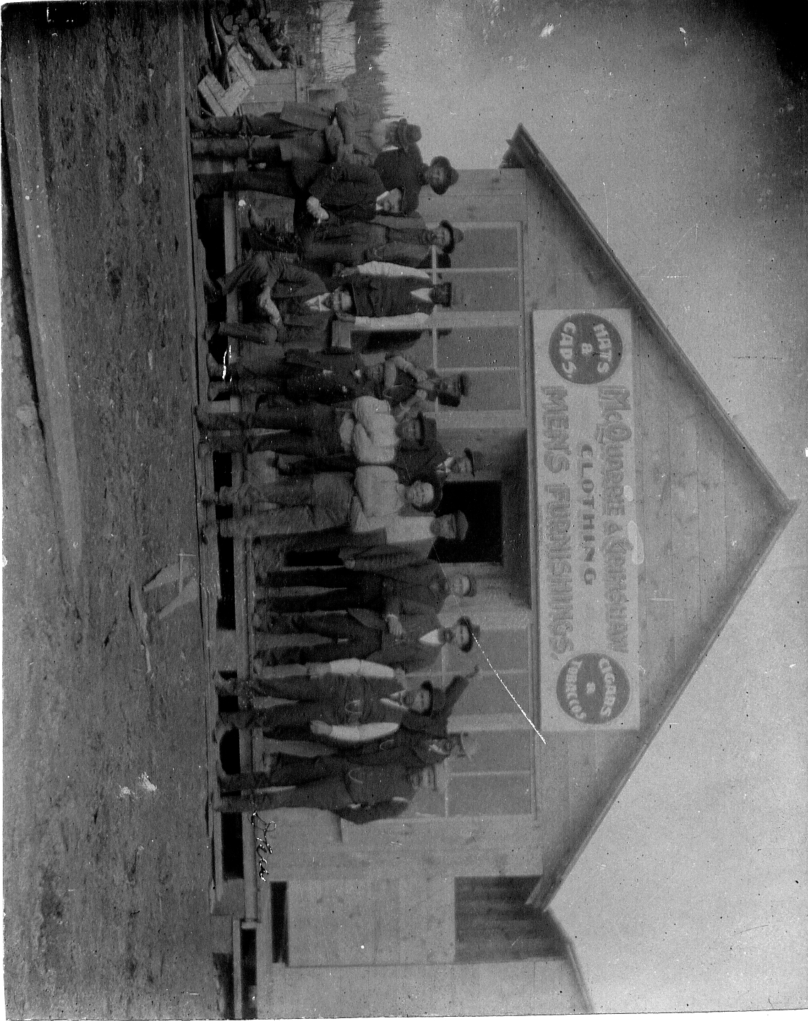 old black and white photo of rainy river residents