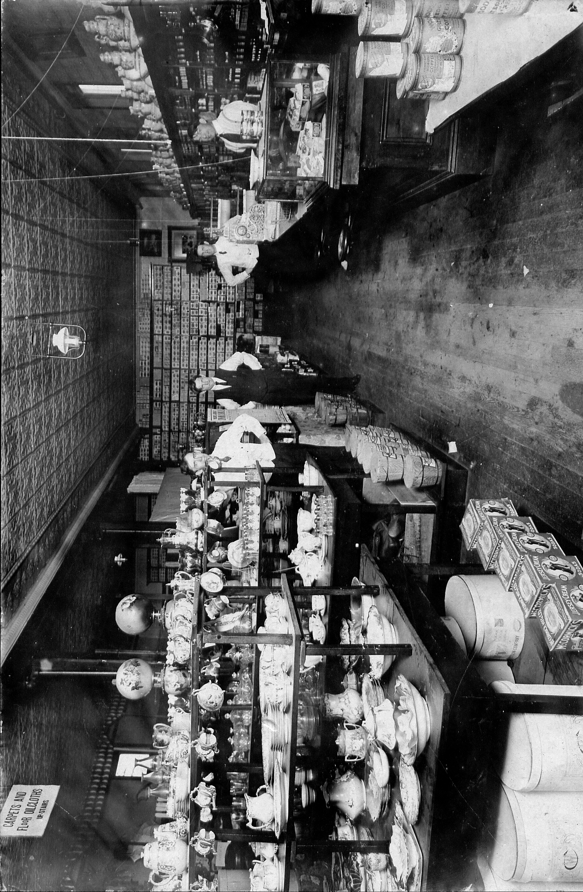 black and white photo of a store selling ceramics