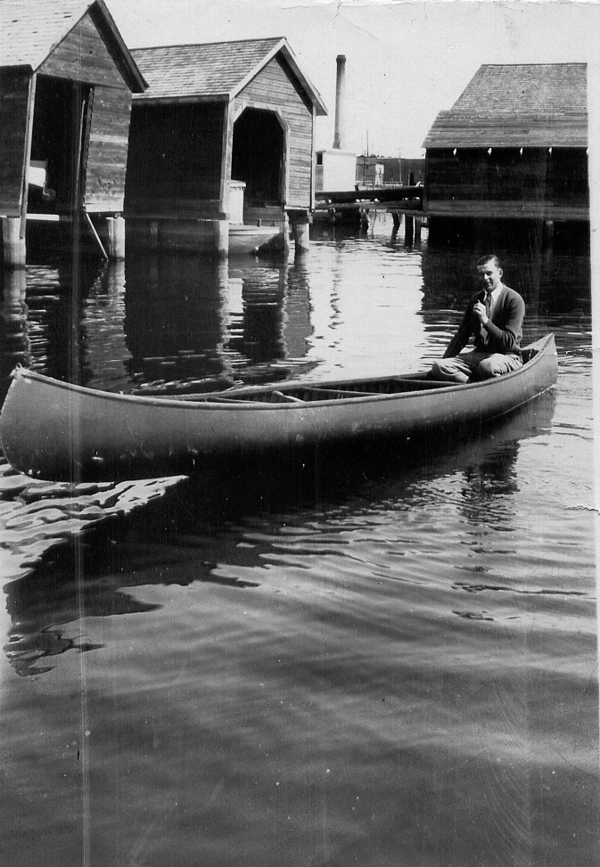 man on a long canoe