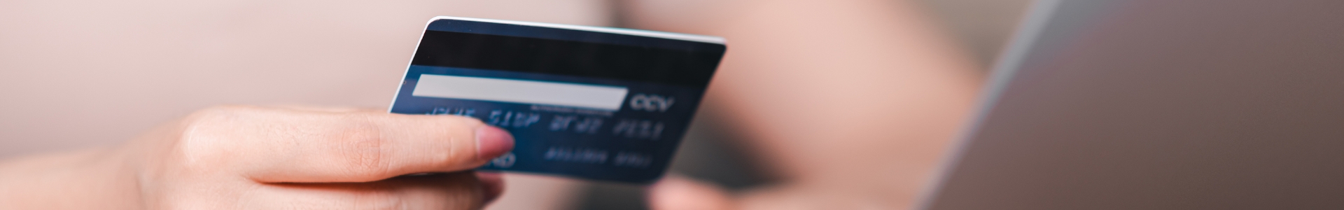Hand holding a credit card
