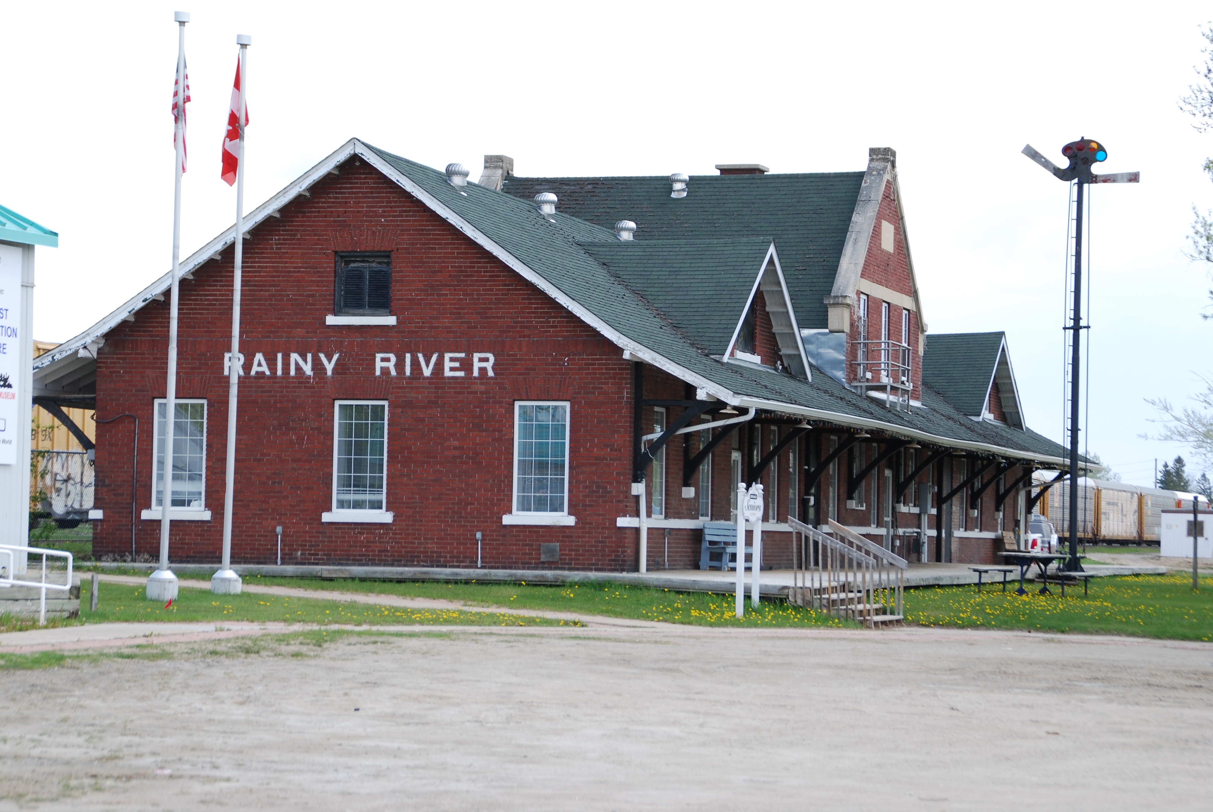 <div class="text-large">a red house with Rainy River on the side</div>