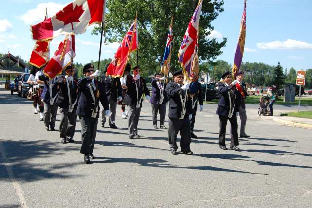 <div class="text-large">a group of people in uniforms waving flags</div>