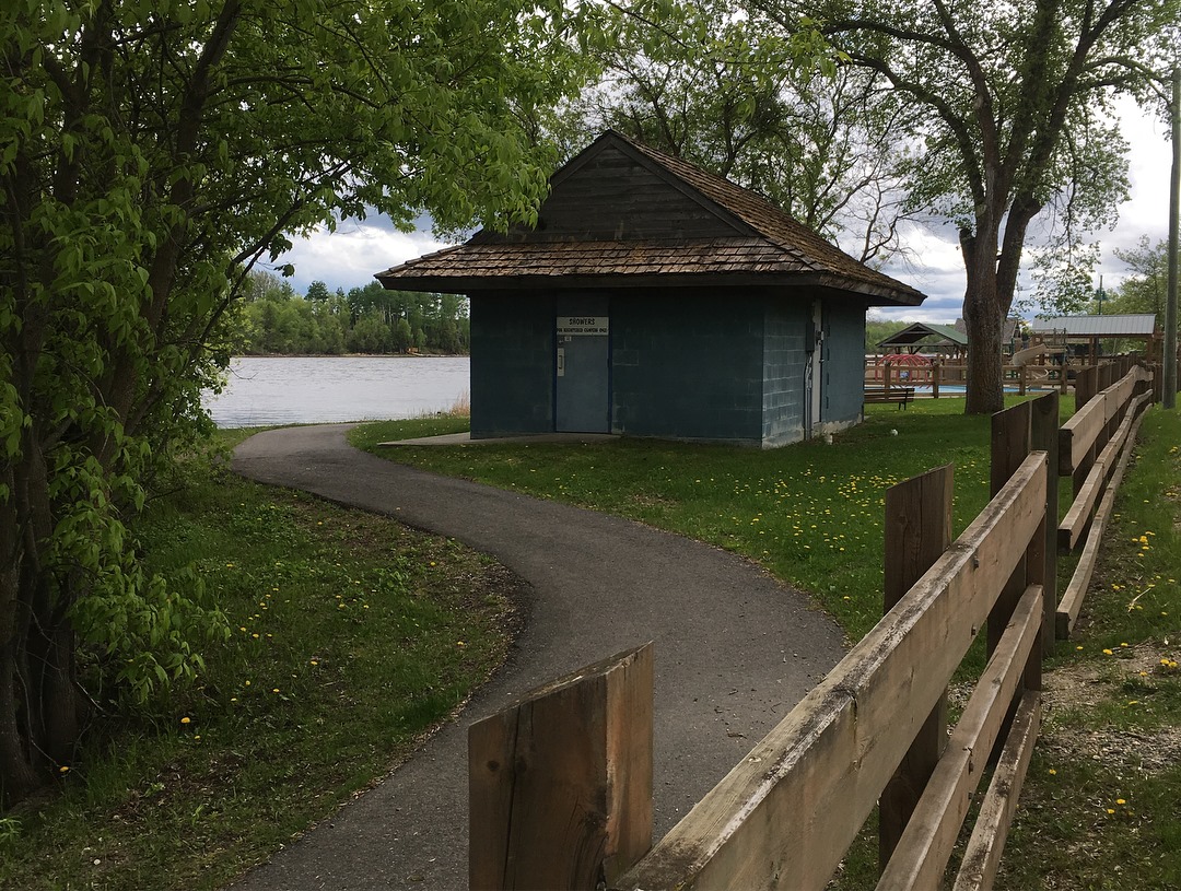 a small house and a trail winding around the house