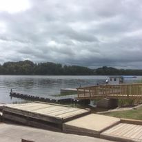 a dock connected to the lake