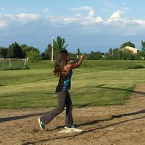 a girl getting ready to catch the baseball