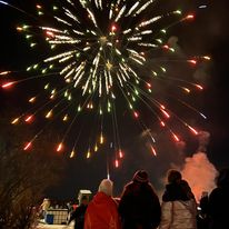 people watching a firework explode