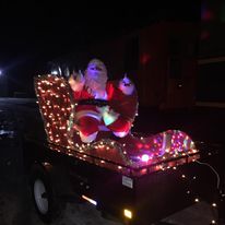 santa on his sleigh with christmas lights
