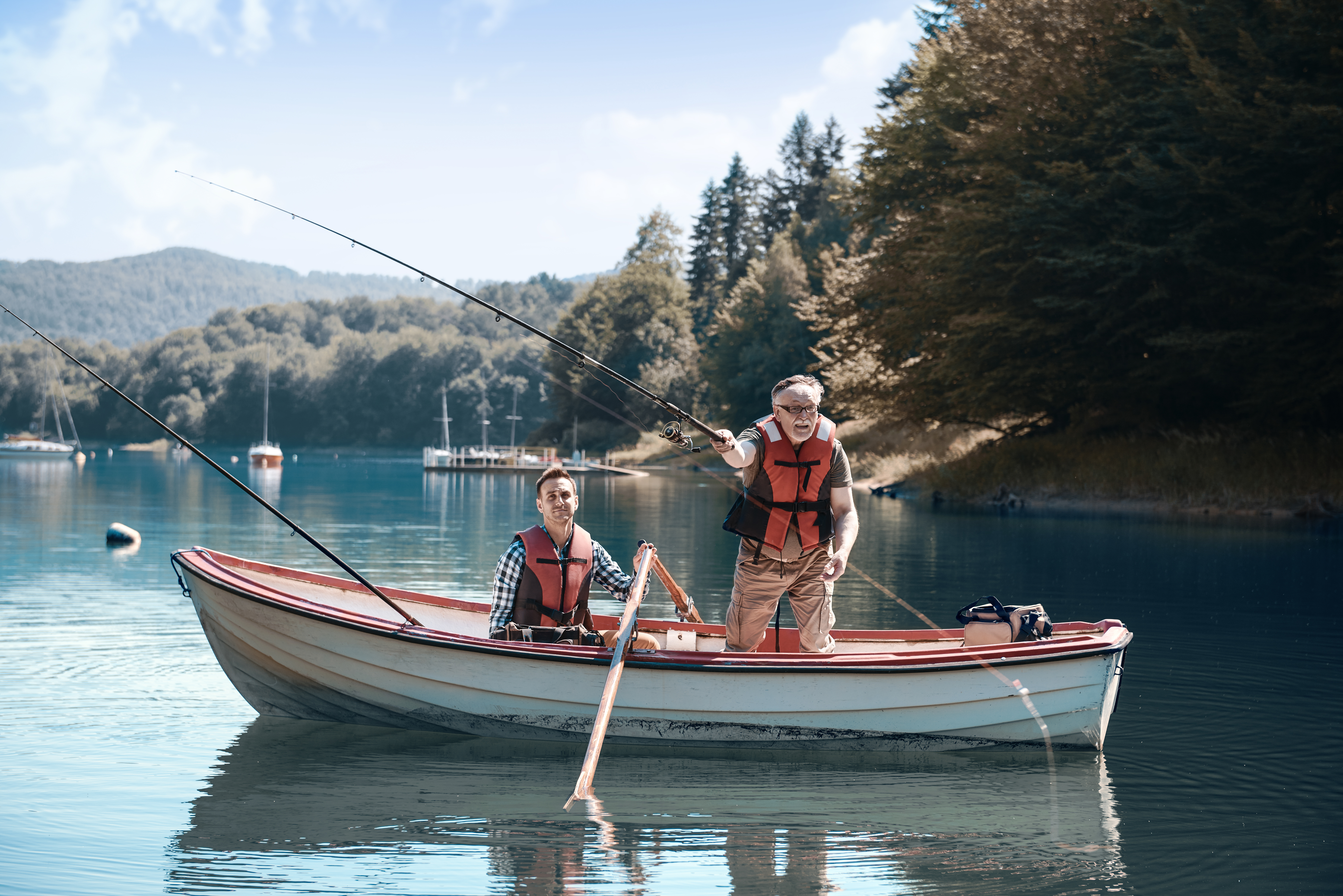 2 men fishing on a boat